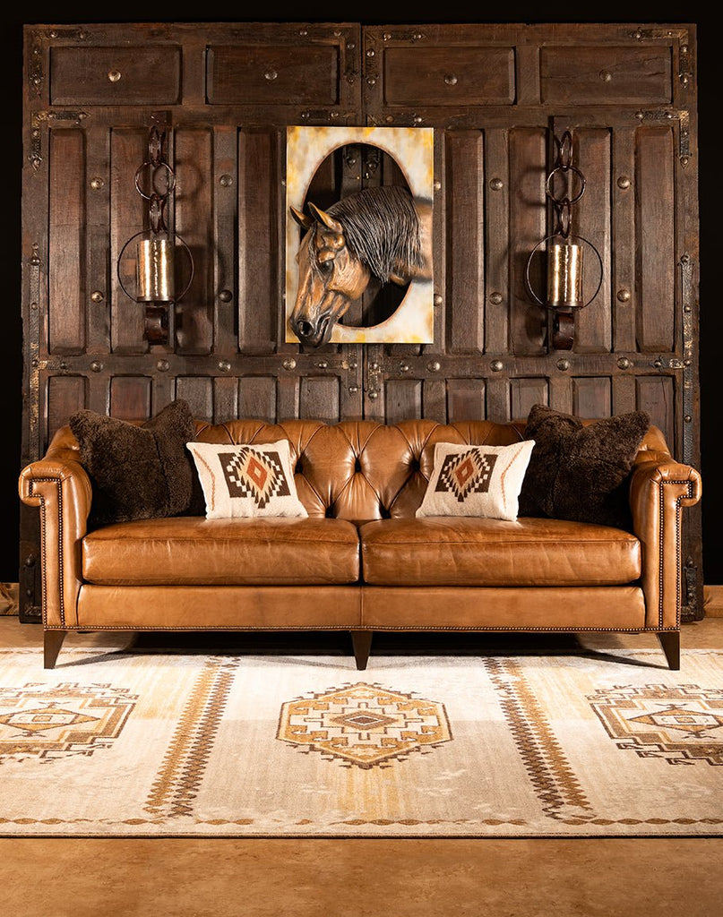 Leather Chesterfield Sofa, wall sconce and horse sculpture - Your Western Decor