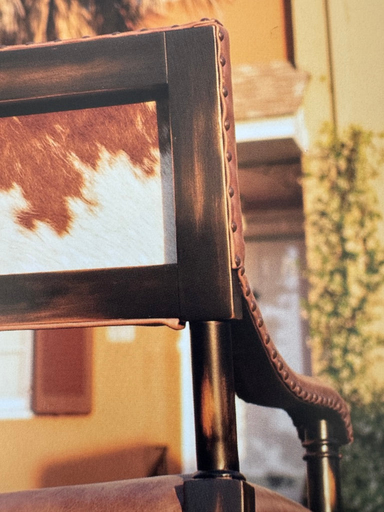 Brown white cowhide back and smooth leather exposed wood accent chair detail