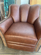 Brown leather armchair with decorative stitching on a rustic background - Your Western Decor
