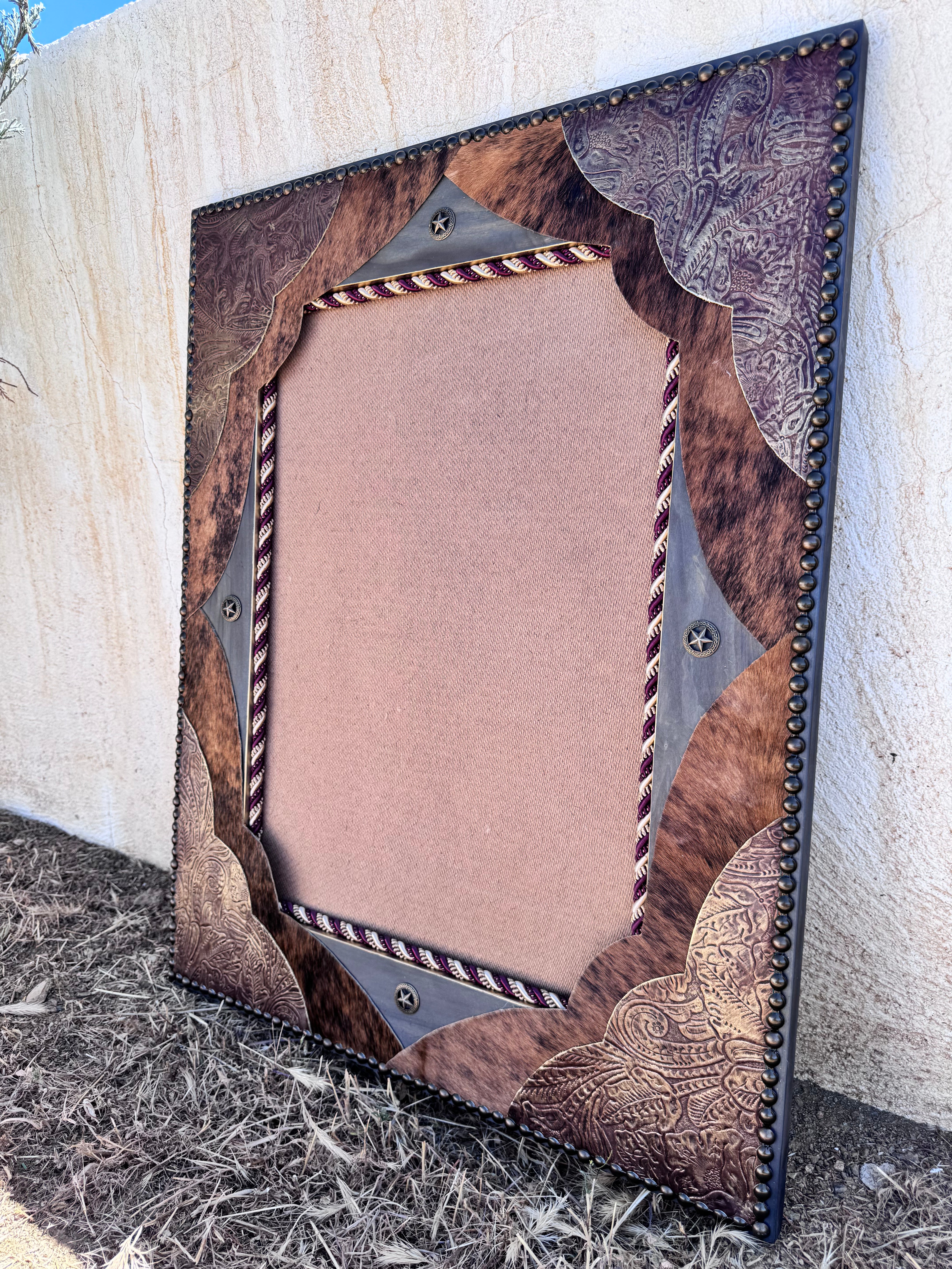 Custom made mirror with leather and cowhide upholstery 