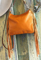 Saddle Arapaho Painted Horizon deerskin leather handbag with hand-painted motif, long fringe and crossbody strap, back side view