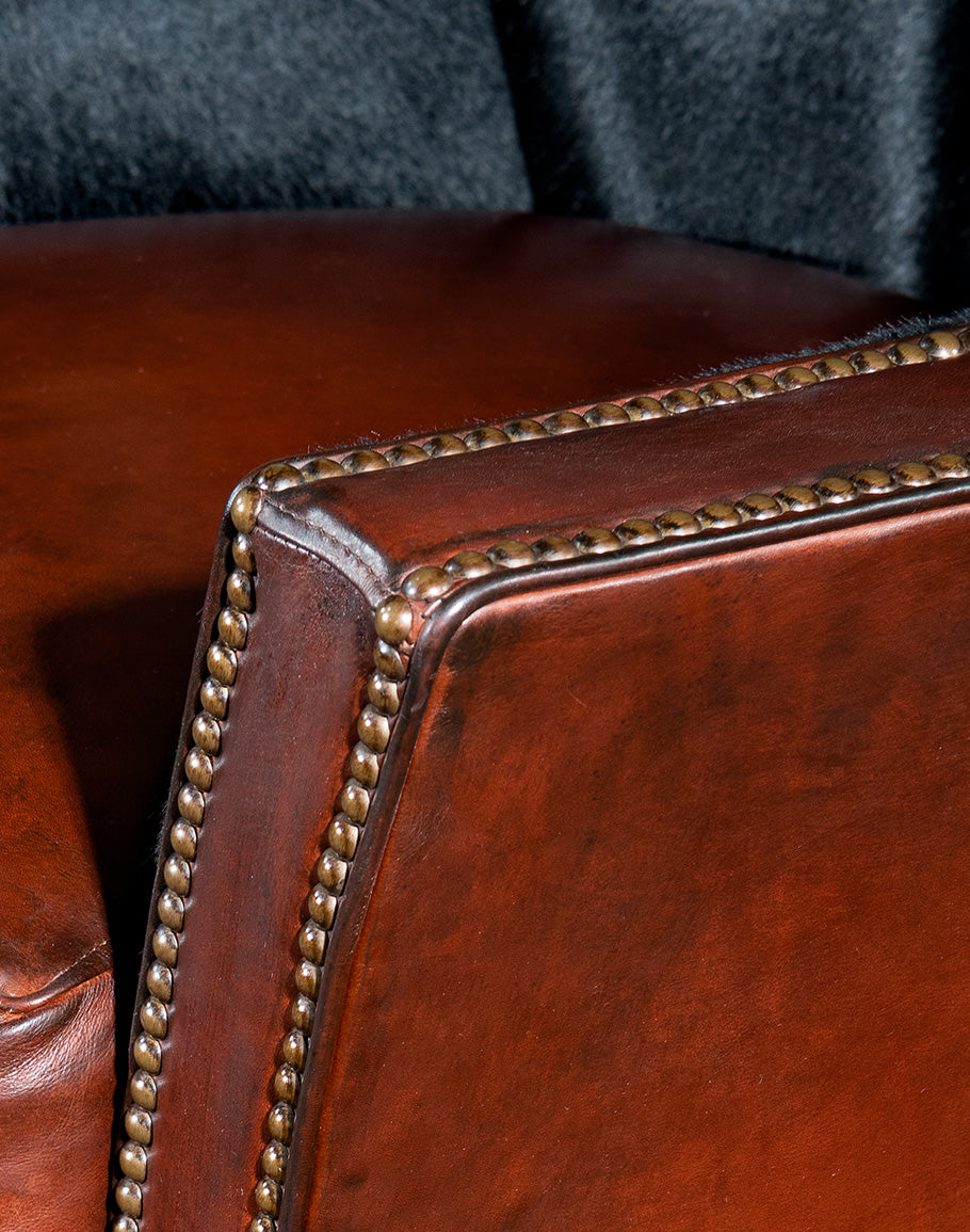 Burgundy brown leather and black cowhide luxury swivel chair made in the USA - Your Western Decor