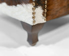 Wingback chair leg detail with nail trim - Your Western Decor