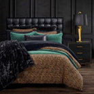 Bed with leopard print and solid color bedding in a darkly decorated room - Your Western Decor