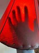 Lit amber rawhide lamp shade image showing transparency 