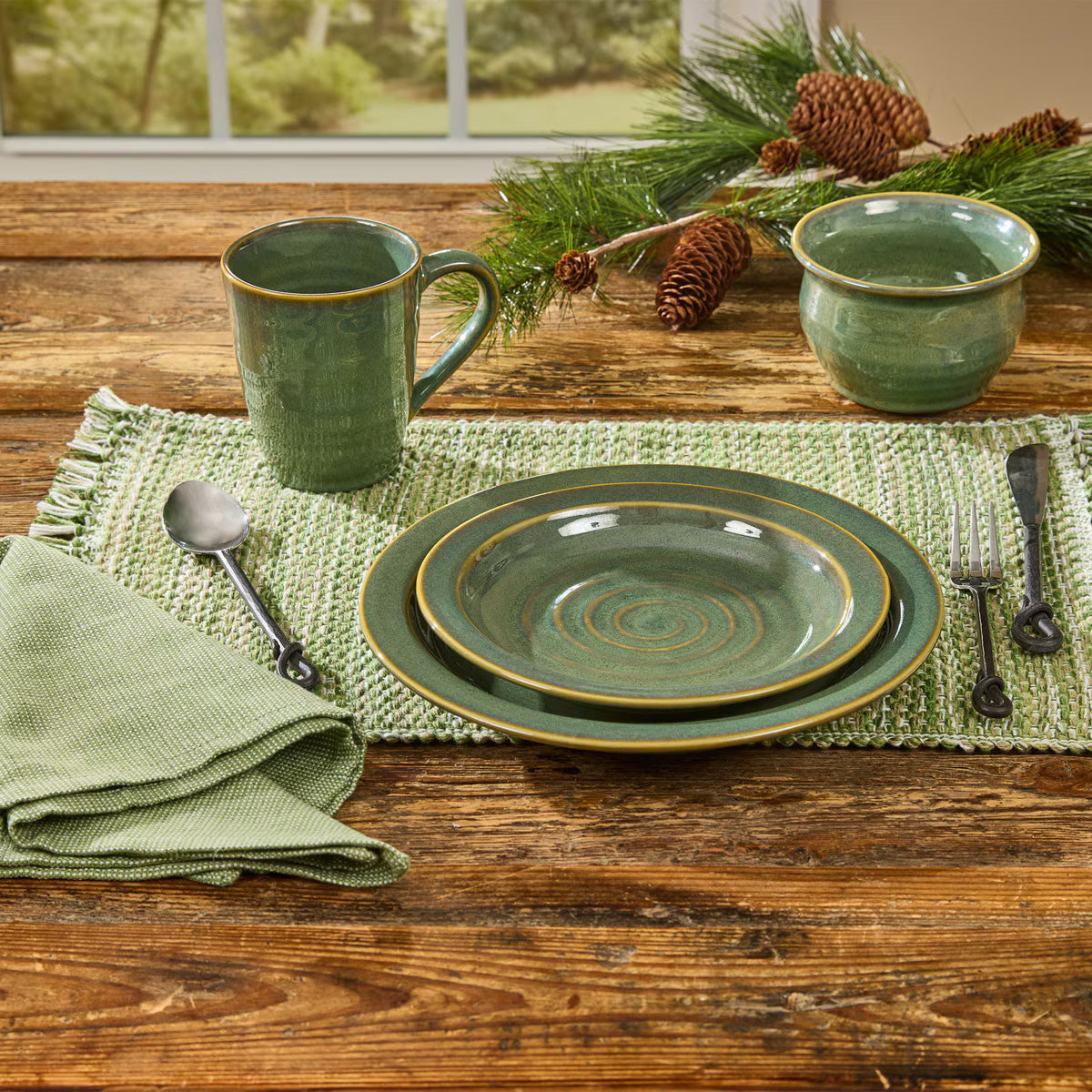 sage green lodge dinnerware set on rustic table
