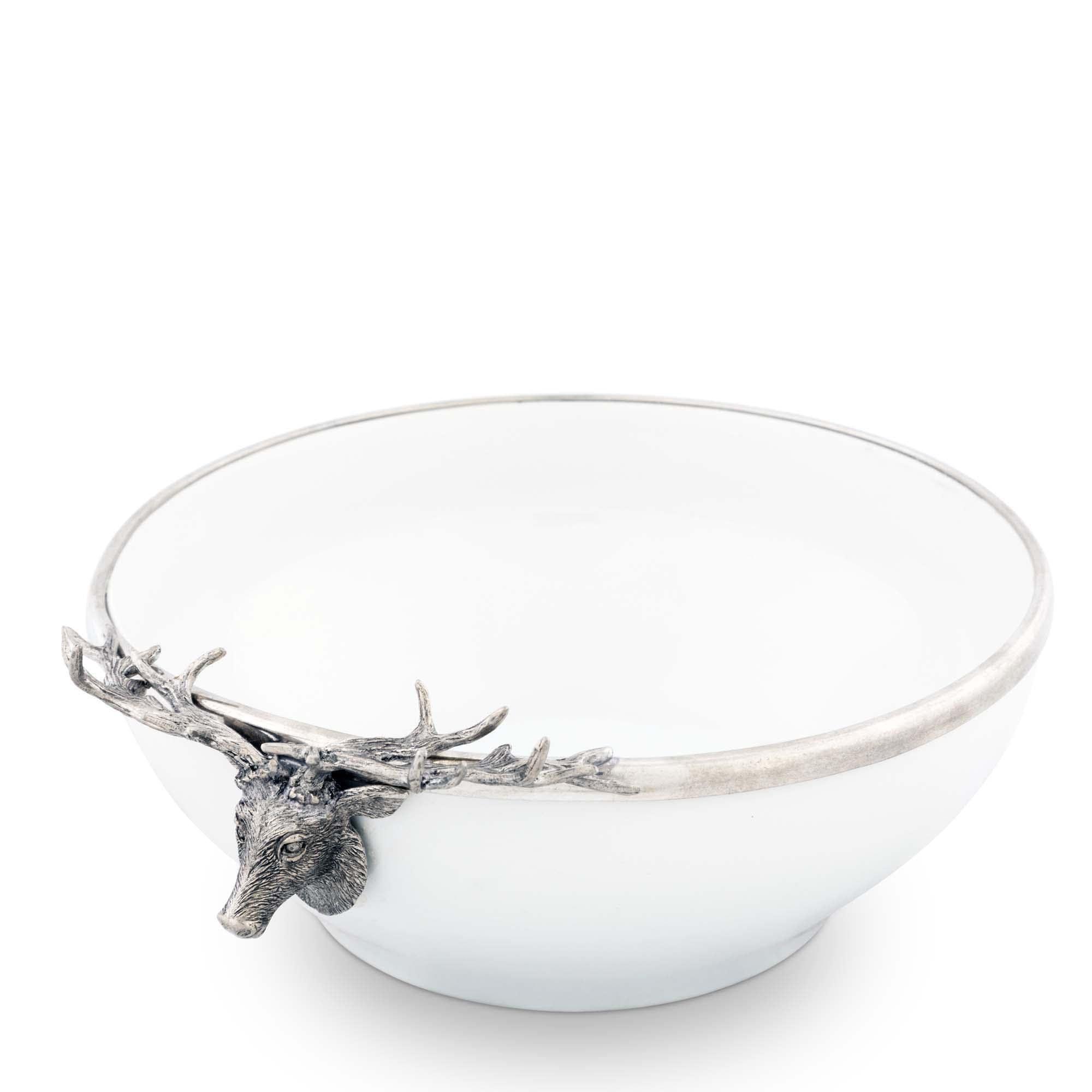 White bowl with silver deer head decoration on a white background