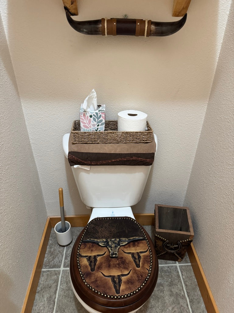 Bathroom with longhorn wall mount and longhorn decorated leather western toilet seat