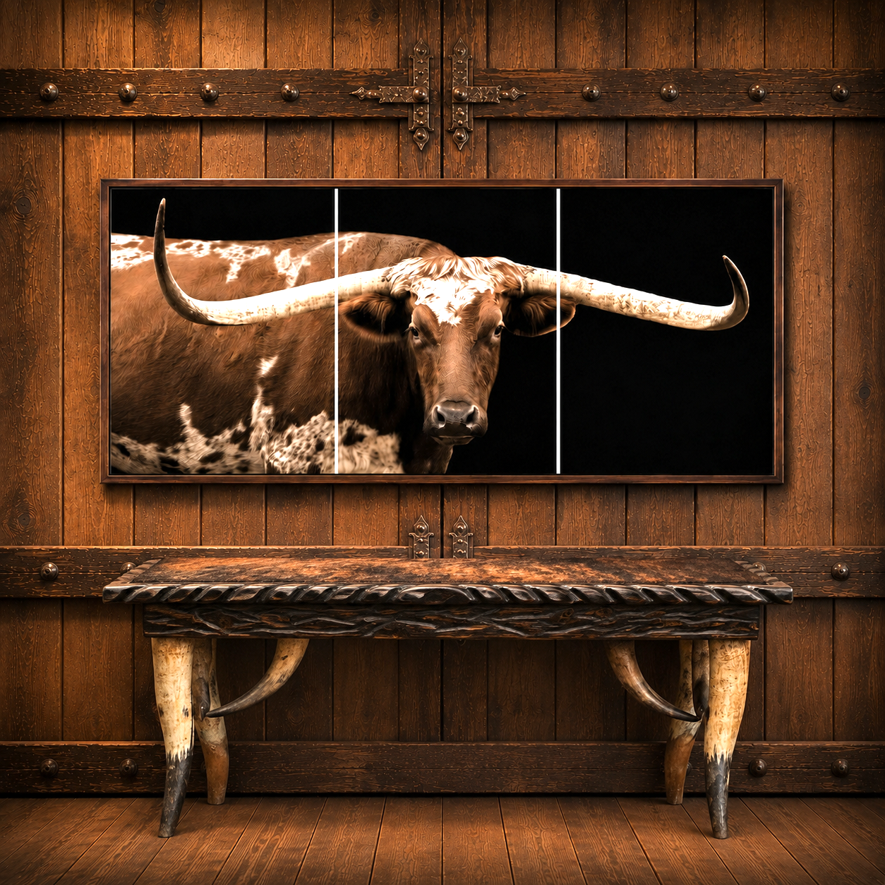 A three-panel framed wall art print showing a close-up portrait of a longhorn steer against a black background, mounted on a rustic wooden wall above a matching wooden console table on longhorn steer legs with brindle cowhide top