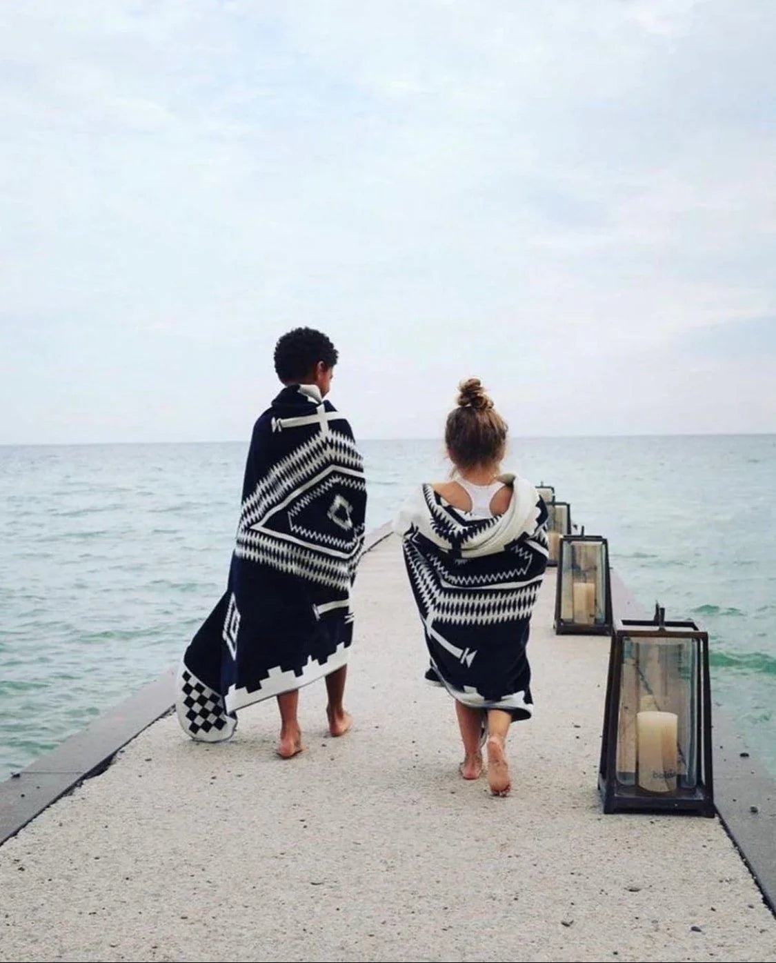 Two kids on the dock at the beach with Los Ojos towels by Pendleton 