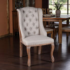Dining chair with tufted backrest in a room with wooden floor and furniture - Your Western Decor