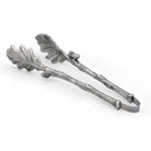 Decorative silver tongs with leaf design on a white background