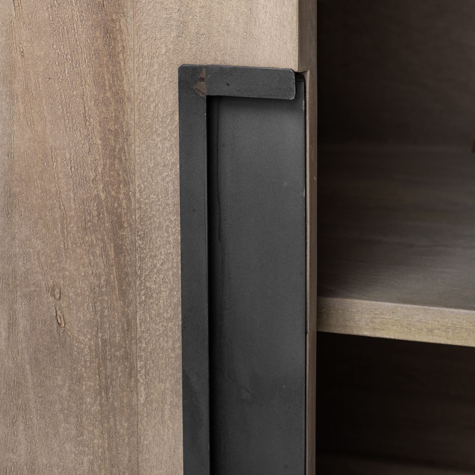 Detail of cabinet door on wood sideboard