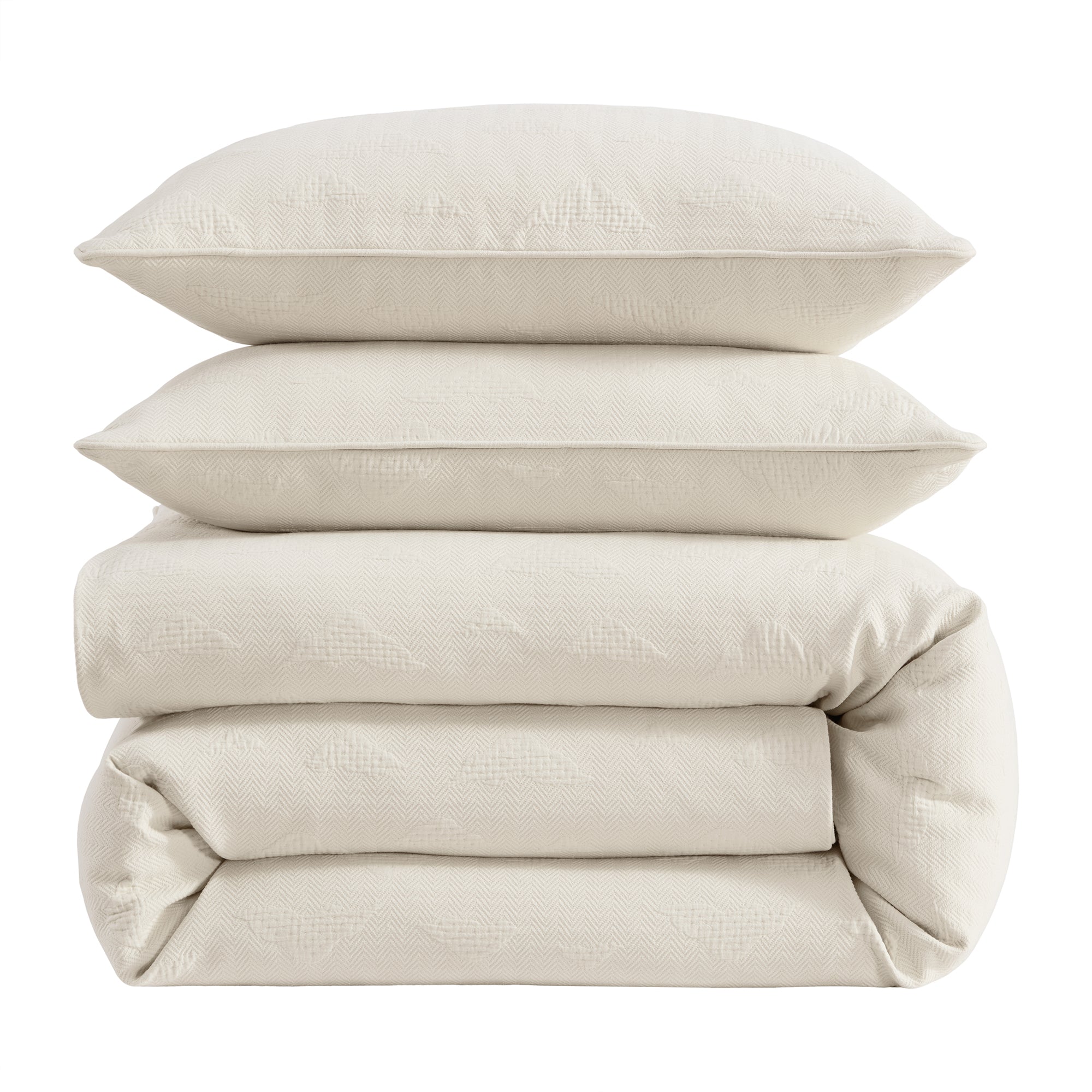 Off-white matelasse bedding set styled in western ranch bedroom with wood furniture and warm tones