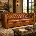 American made chestnut brown leather sofa with deep button tufting and nail trim 