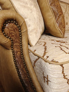 Close up of Mesa sofa showing Mesa southwestern fabric, smooth and embossed leathers, and nail trim