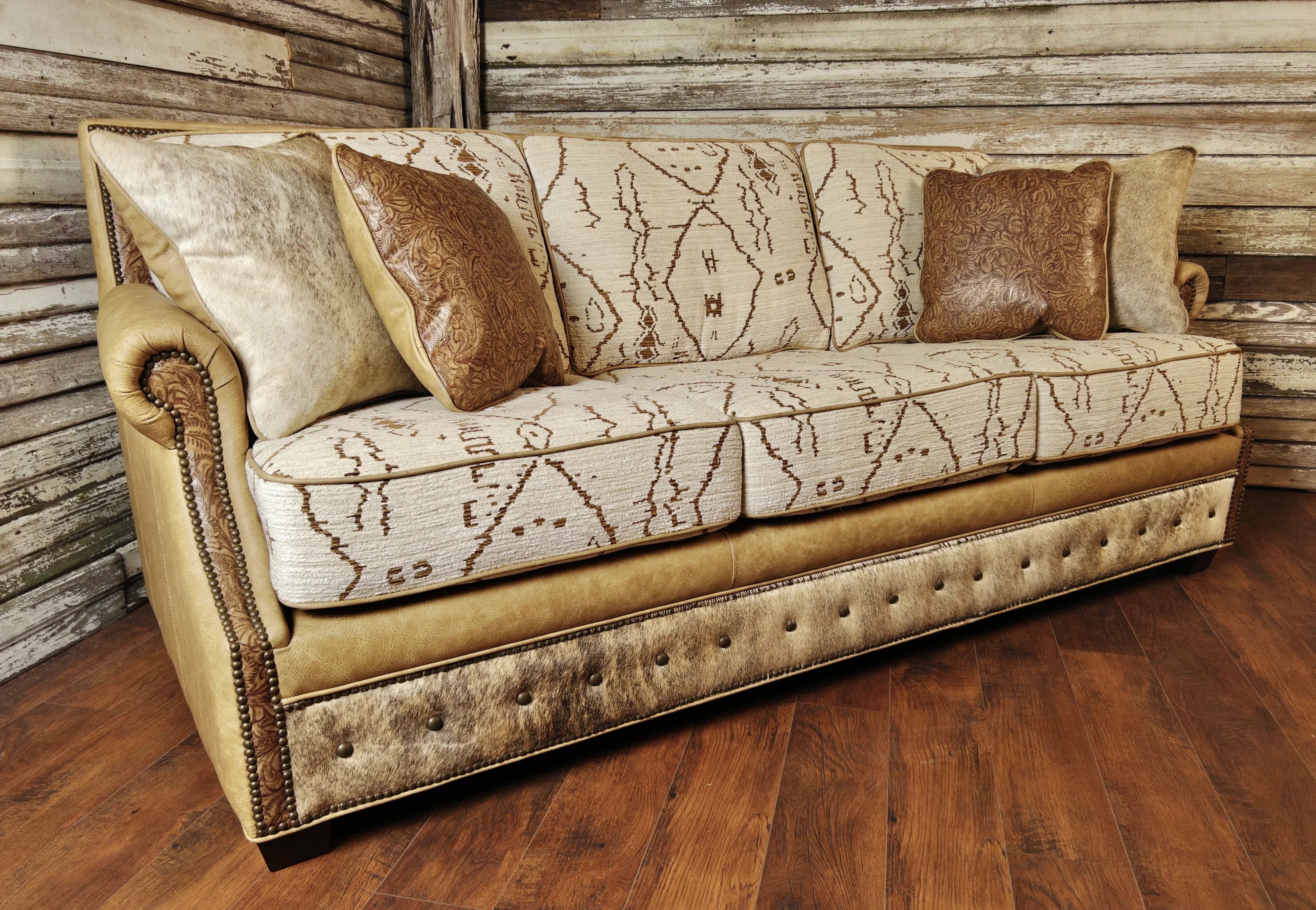 Mesa Southwestern Sofa in Mesa Adobe fabric, palomino smooth leather, western floral embossed leather, light brindle cowhide, and nail trim 