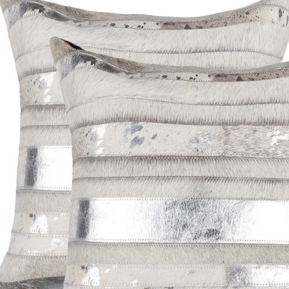Luxury accent pillows in silver metallic and grey and white cowhide 