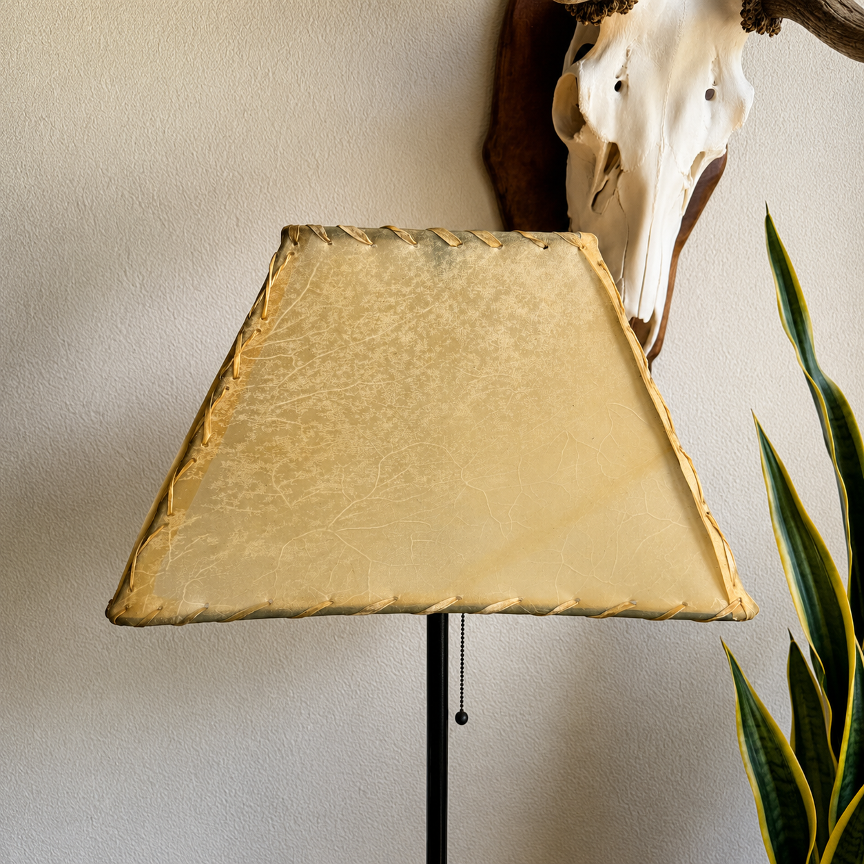 Natural rawhide lamp shade, rectangle with rawhide whip-stitching and veining detail 