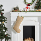 Decorated Christmas mantel with stockings and wreaths on a white fireplace - Your Western Decor