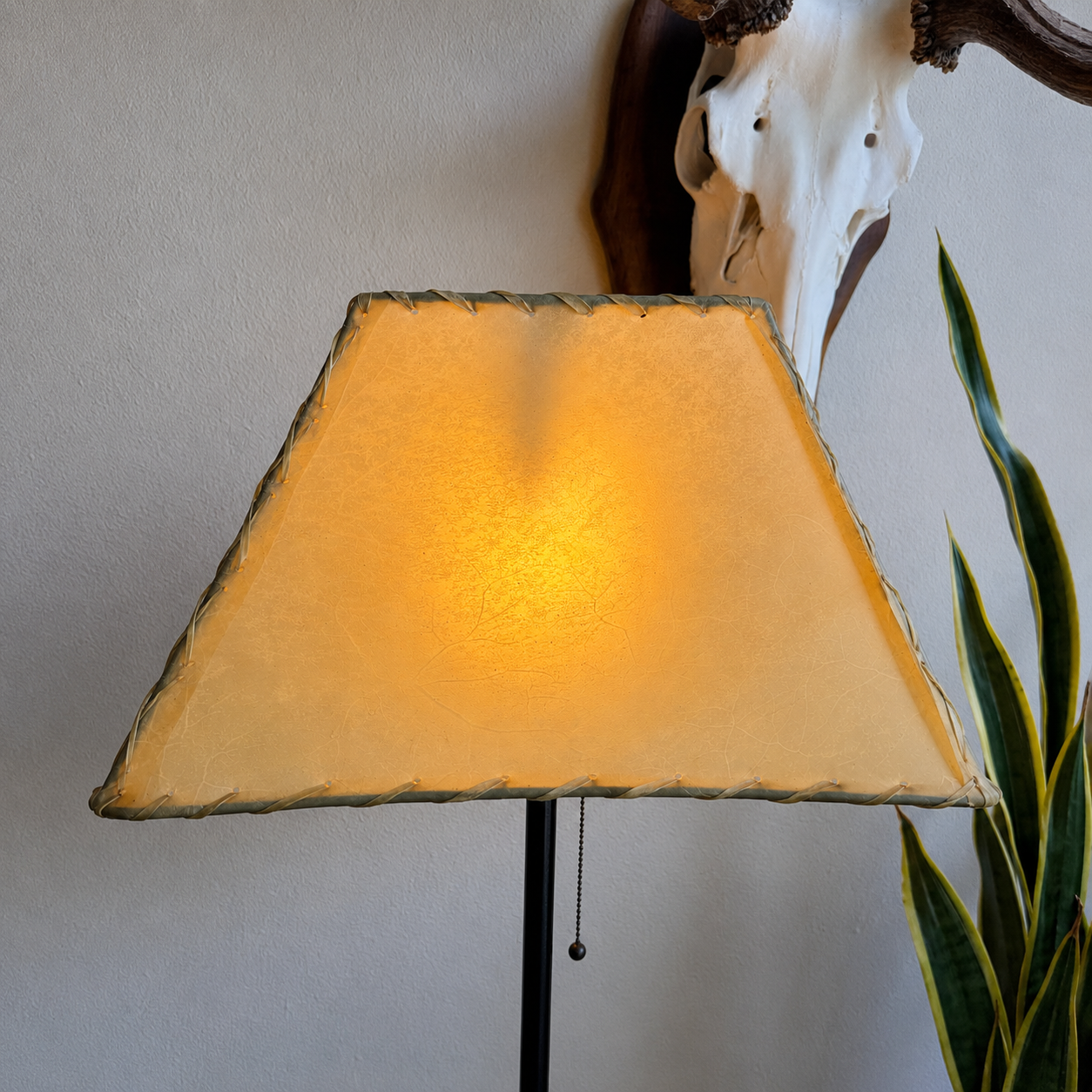 Rectangle natural rawhide lamp shade with whip stitching and visible veining 
