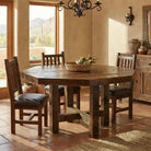 solid wood barnwood dining table and chairs in warm lodge dining space with tile flooring