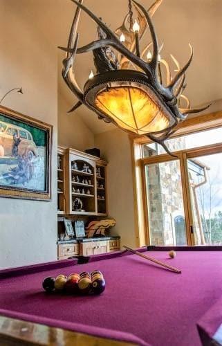 Rawhide and antler pool table chandelier made in the USA - Your Western Decor