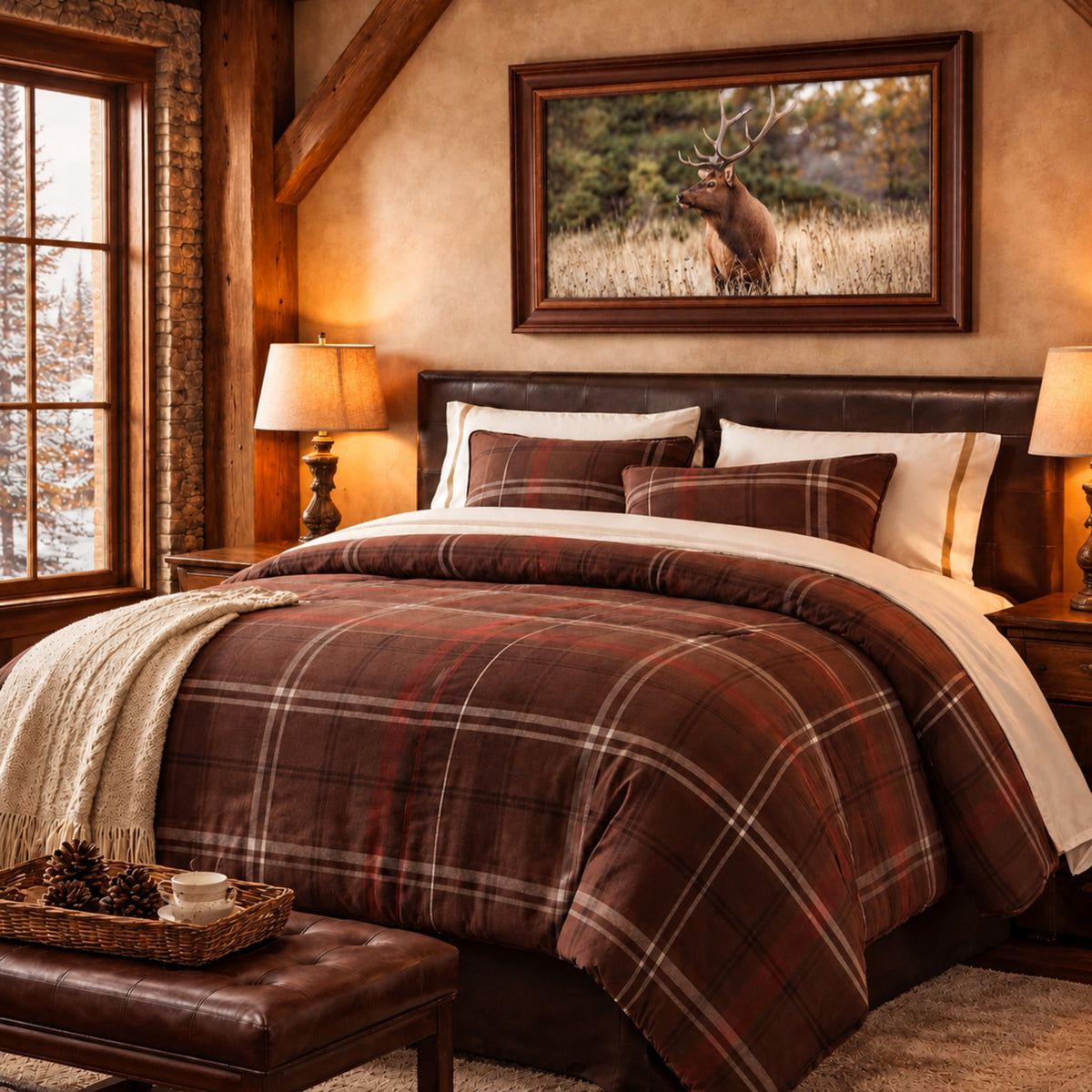 A rustic bedroom scene featuring a bed dressed in a brown and red plaid comforter set with matching pillows. Above the bed hangs a framed print of a bull elk in a field.