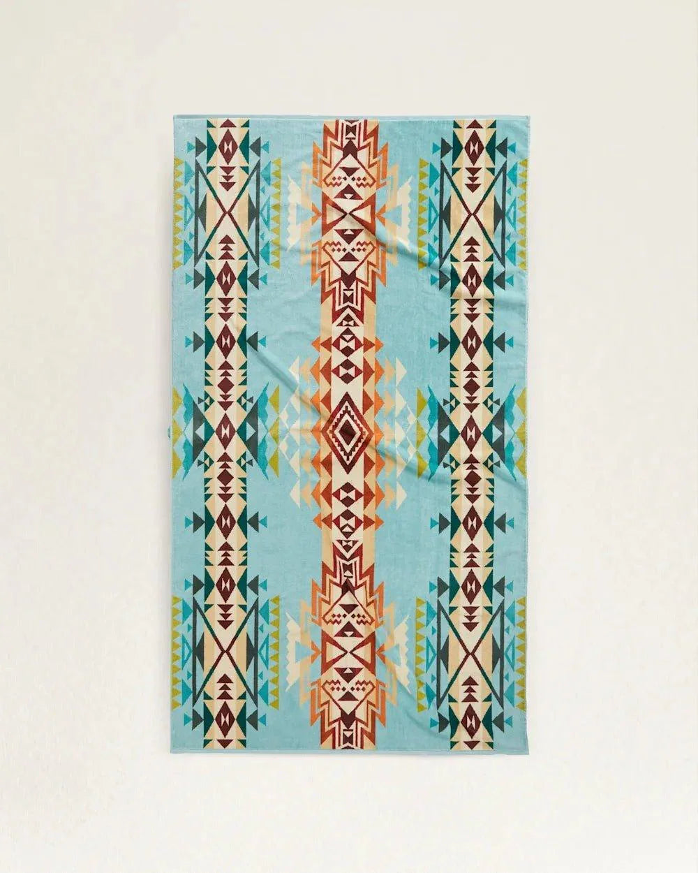 Discontinued Pendleton Highland Peak Spa & Beach Towel featuring vibrant turquoise Southwestern-inspired pattern in organic cotton velour.