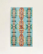Discontinued Pendleton Highland Peak Spa & Beach Towel featuring vibrant turquoise Southwestern-inspired pattern in organic cotton velour.