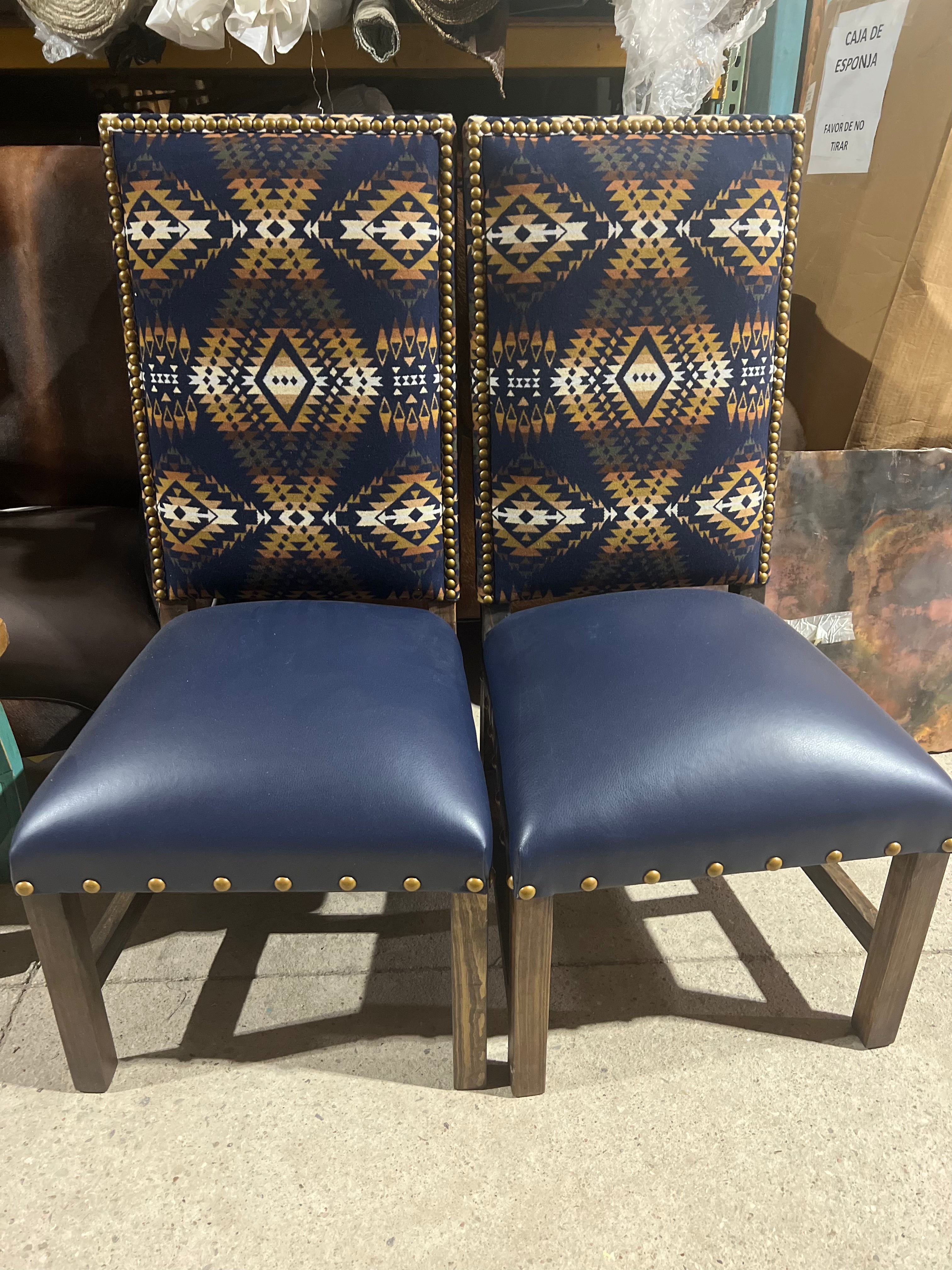 Pendleton Mission Trails dining chairs with deep blue leather seats in factory