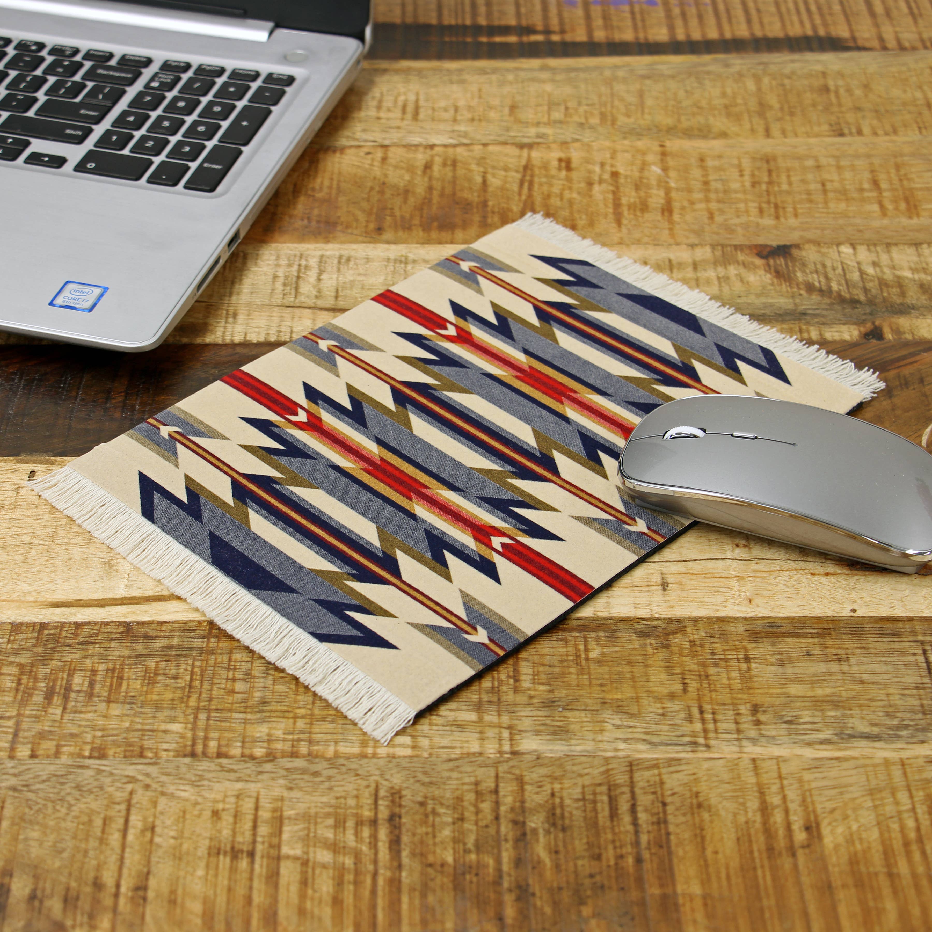 Pendleton Wyeth Trail western mouse pad with fringe on rustic wood desk