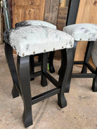 handcrafted peppered cowhide bar stools with black wood frame