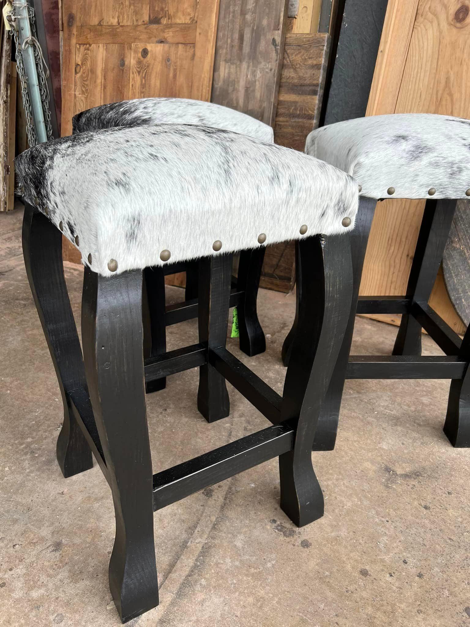 handcrafted peppered cowhide bar stools with black wood frame