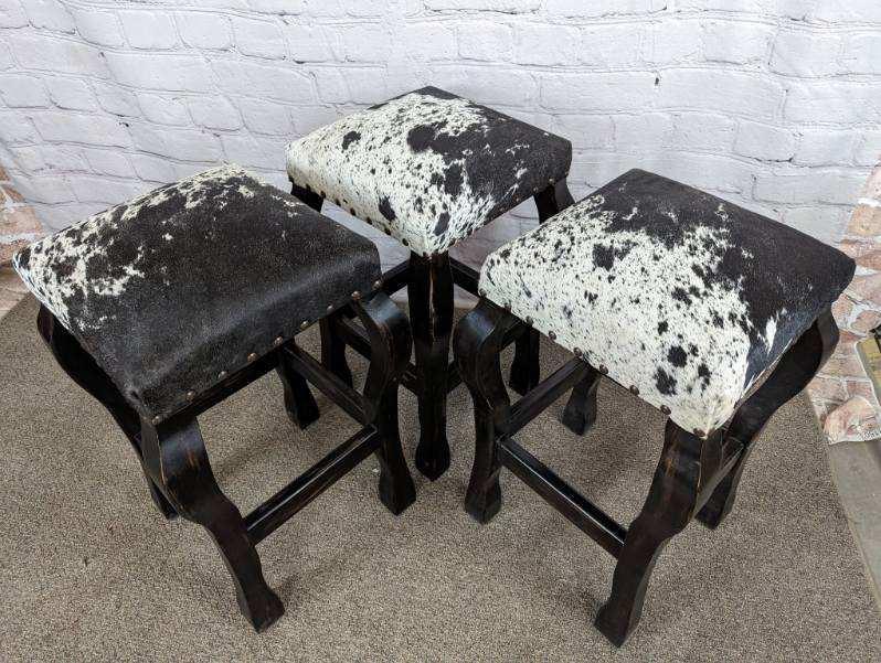 genuine cowhide bar stools made in the USA with black frame 