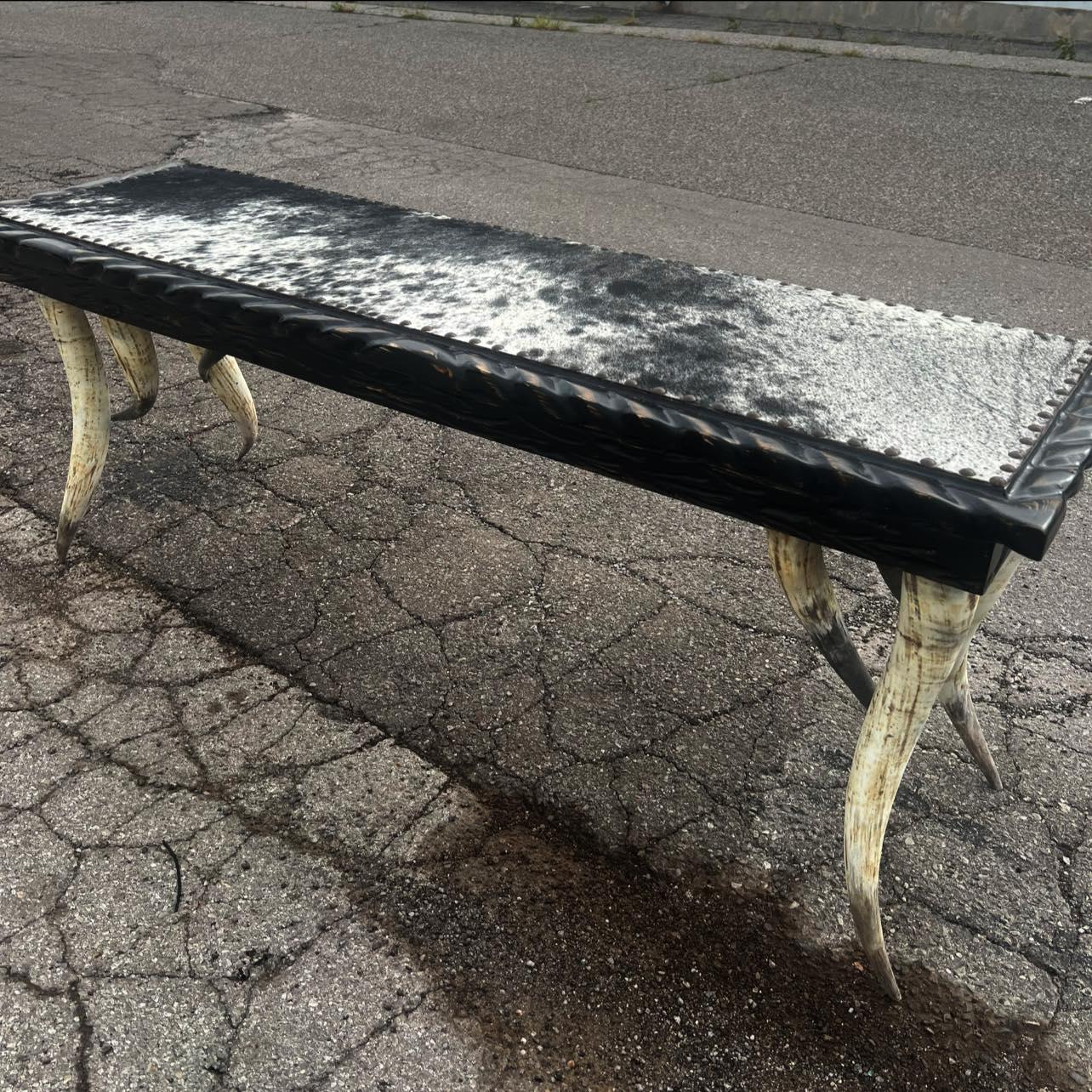 Rustic Western console table with authentic steer horn legs and cowhide top