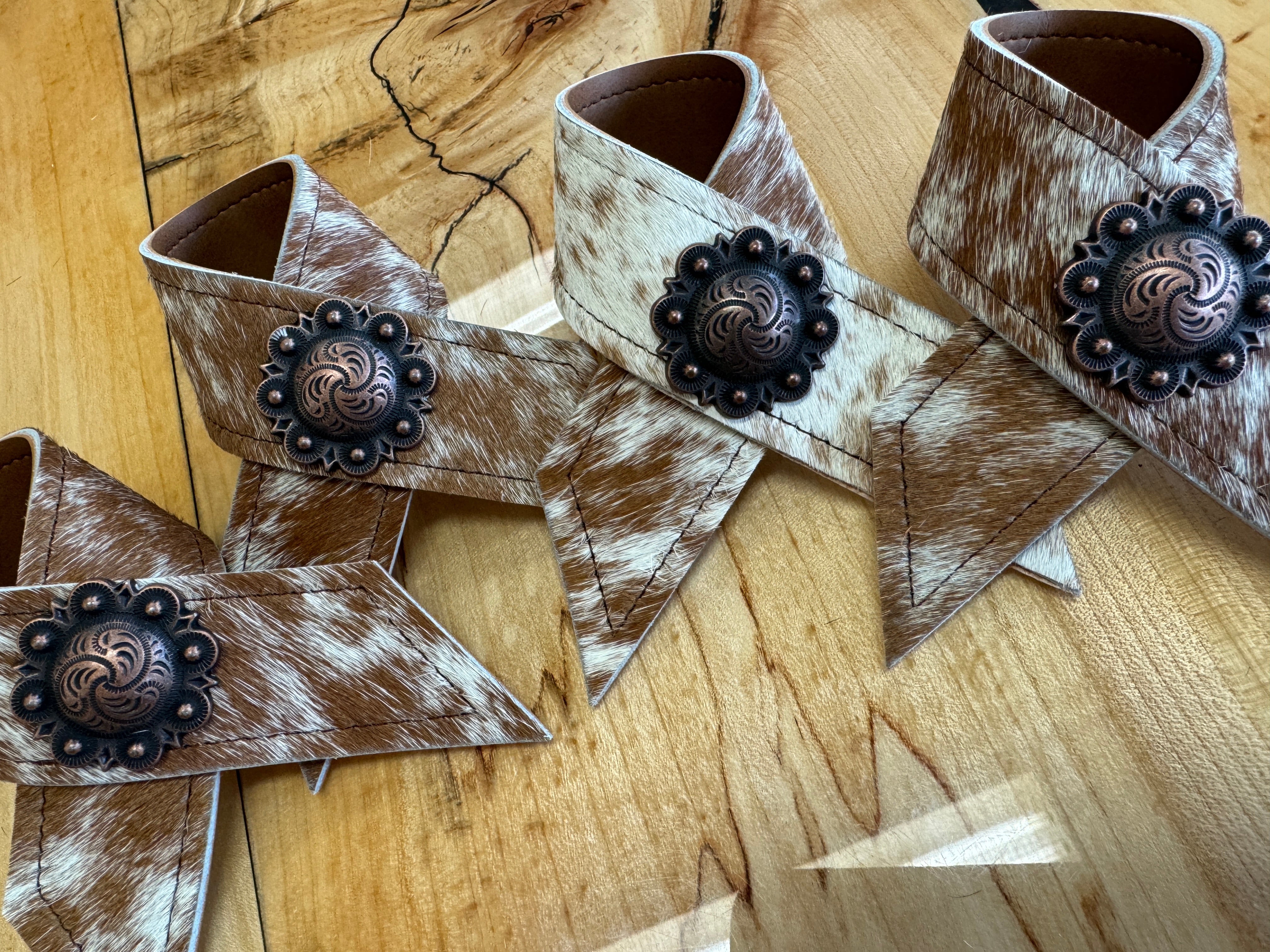 Peppered Cowhide Napkin Rings with conchos - Your Western Decor