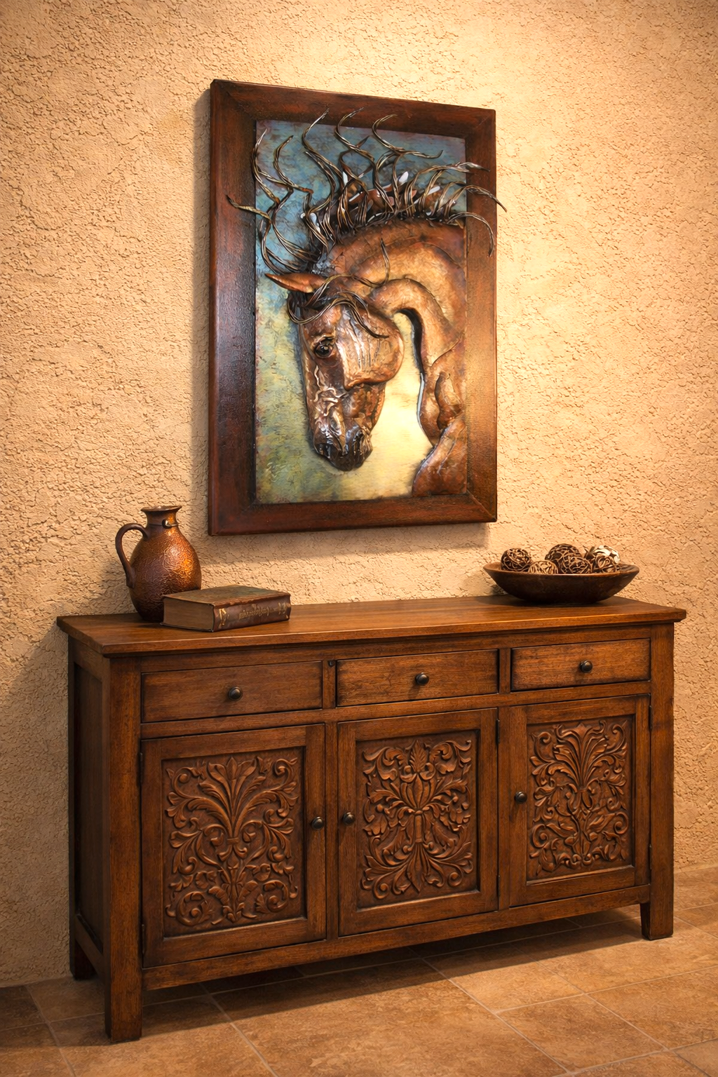 Wooden sideboard with decorative carvings below a framed sculpture of a horse's head on a textured wall - Your Western Decor