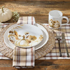 Autumn-themed table setting with pumpkin and leaf design on a plate, mug, and placemat - Your Western Decor