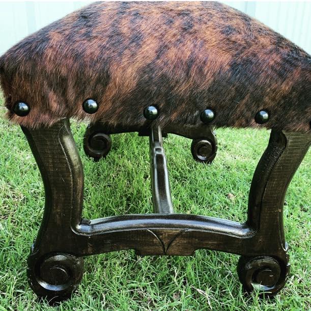 Fully dark brindle cowhide upholstered bench with hand carved frame 