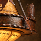 Detail of iron and rawhide custom made rustic chandelier 