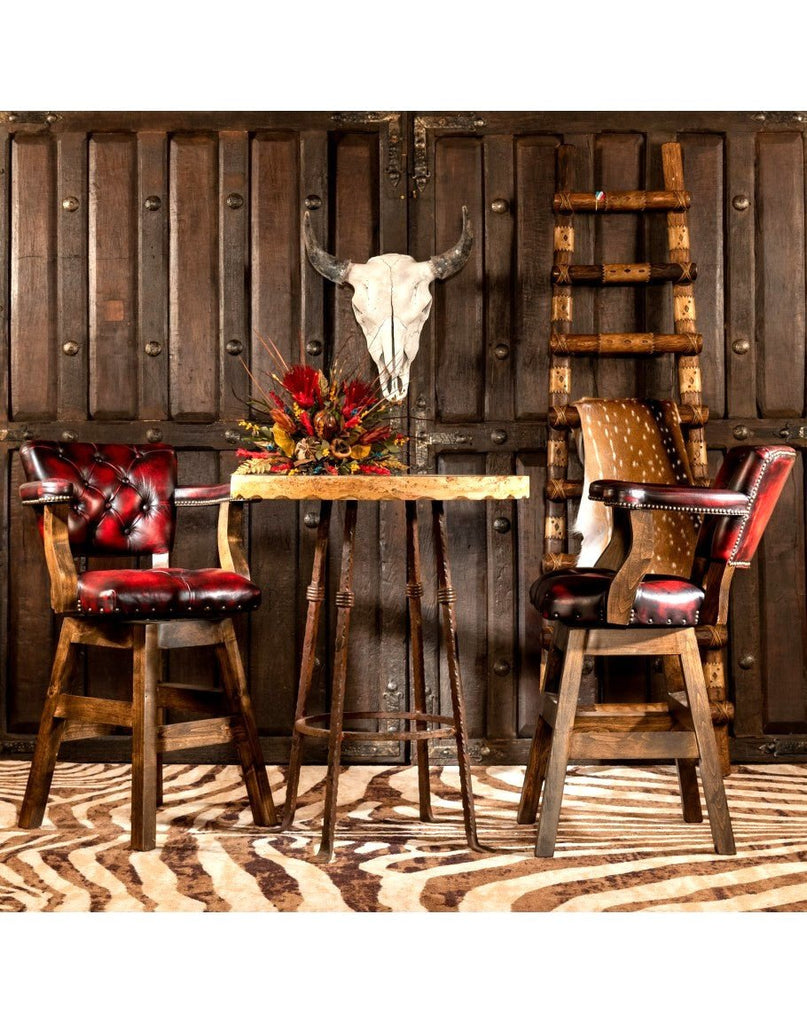 Rustic bar setting with travertine table and burnished red leather bar chairs - Your Western Decor