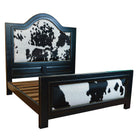 Distressed ebony bed frame with black and white cowhide upholstery finished with nailhead trim - Your Western Decor