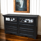 Regal ebony 6-drawer dresser with black and white cowhide drawer fronts with nailhead trim