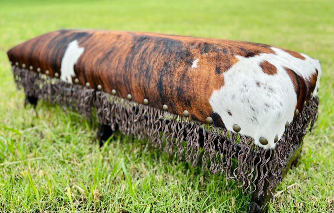 Tri color/brindle cowhide bench with hand carved frame and hand twisted fringe - Your Western Decor