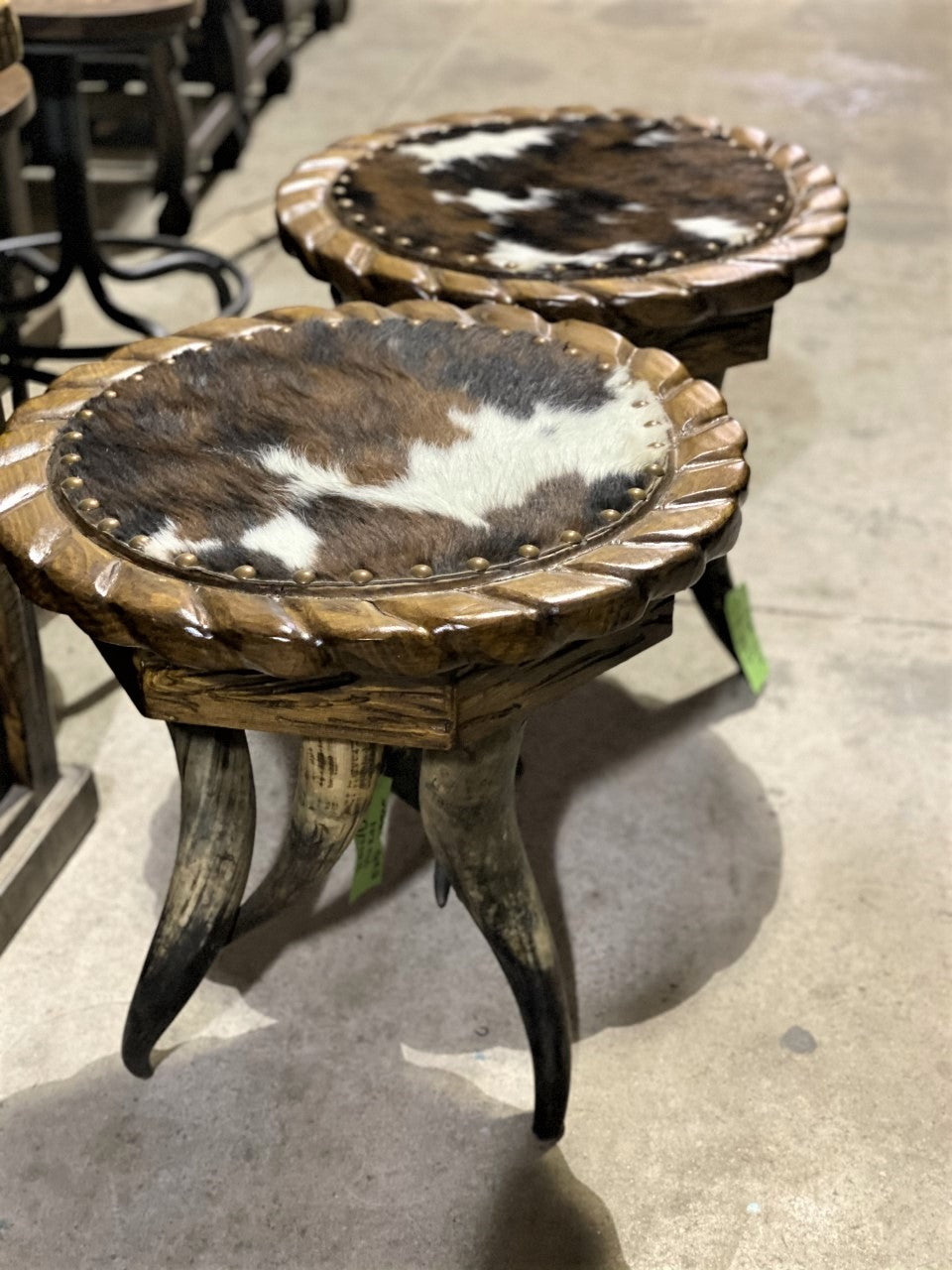 Round horn side tables with tri color cowhide tops 