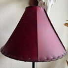 Round red leather lamp shade with whip stitch detail 