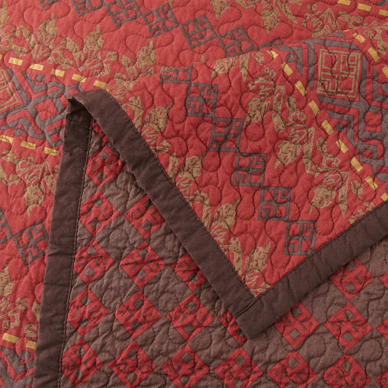 Front and back detail of Rushmore quilt in reds and browns