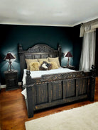 Decorative bedroom with a large wooden bed, nightstands, and lamps. Your Western Decor