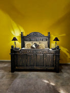 Decorative bedroom with a large wooden bed against a yellow wall - Your Western Decor